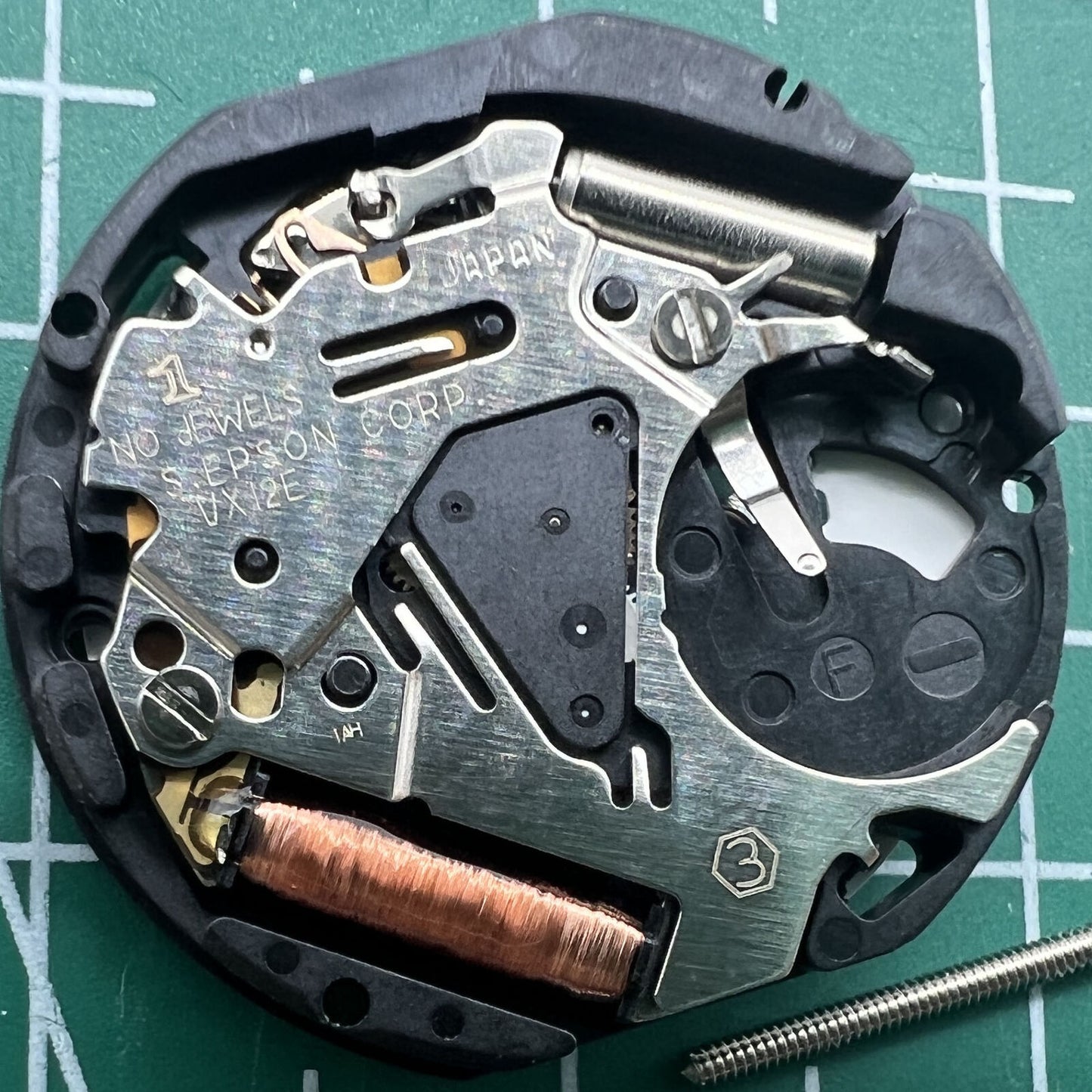 Hattori Epson VX12E quartz watch movement with date at 3 o'clock, precise timekeeping accessory