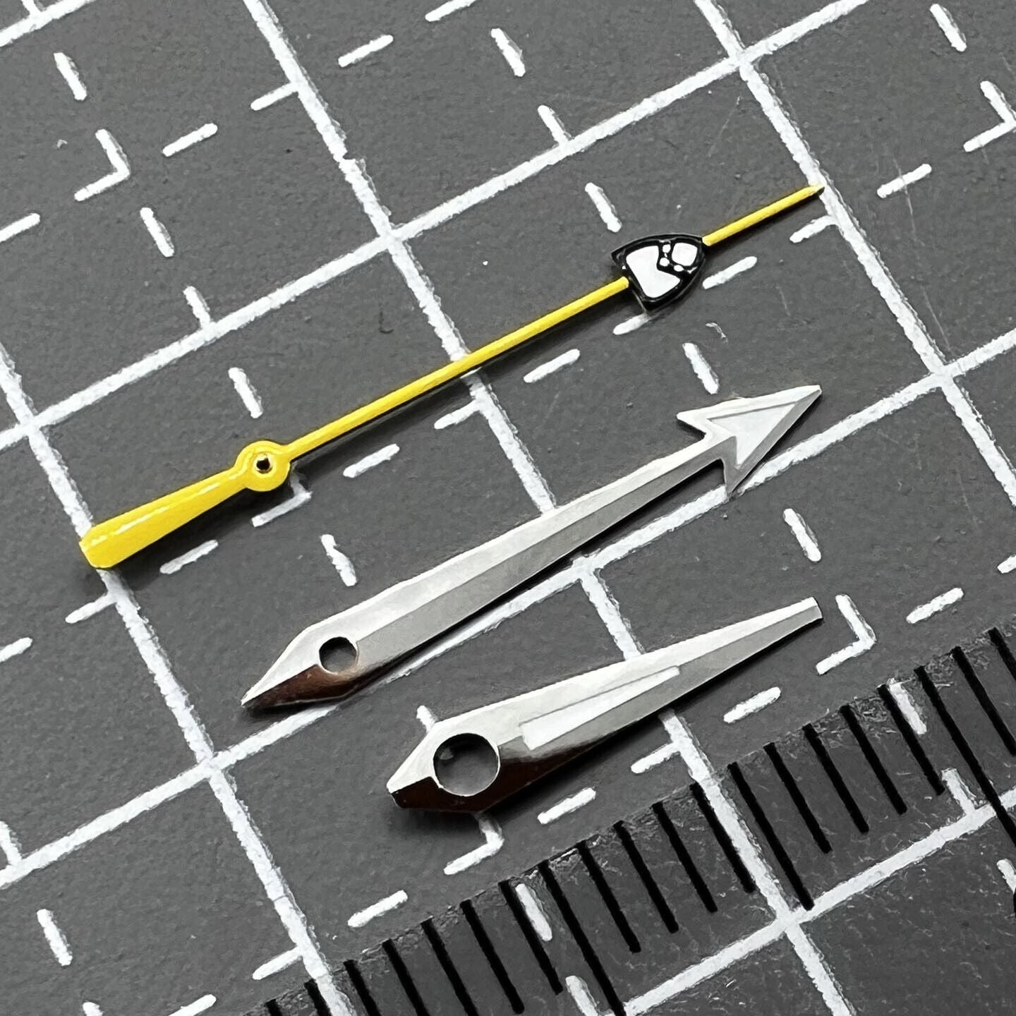 Yellow pointed second hand with green luminescence, compatible with NH35/36 watch movements, ideal for repair or customization.