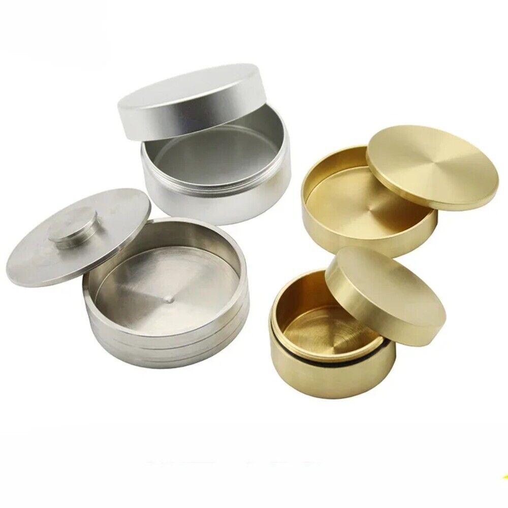 Steel and copper watch oil cylinder for precise watch repair and maintenance.