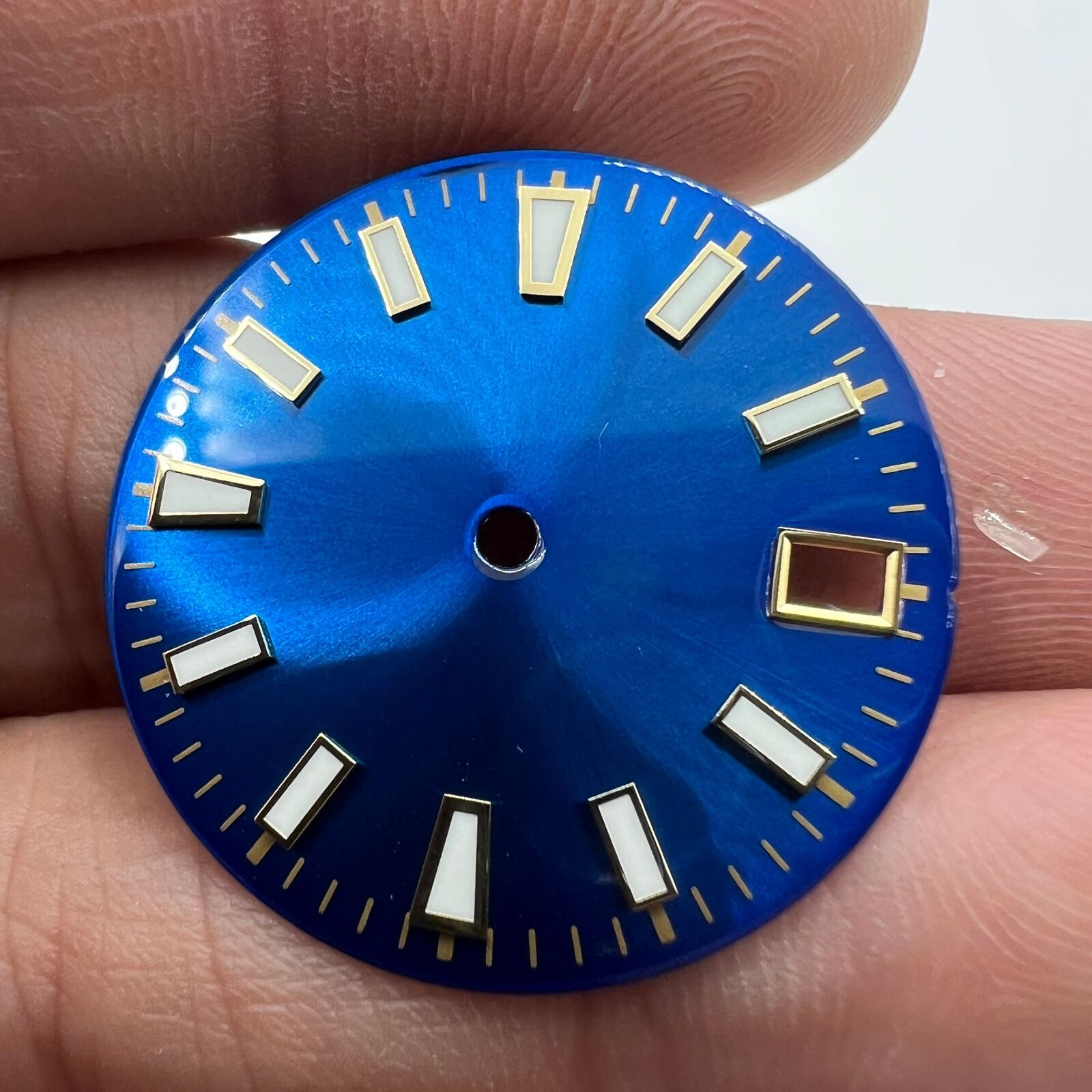 Green luminous blue and gold watch dial with nail trim detail for NH35 movement.