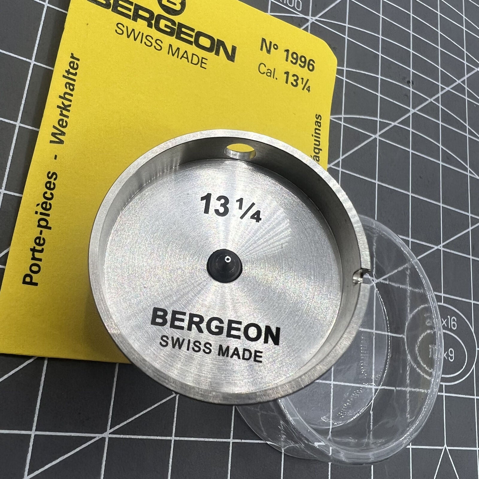 Bergeon 1996 13 1/4 watch movement holder with hollow center screw for precise repair.
