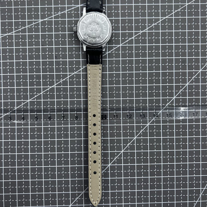 27mm Kongque watch with black leather strap, silver dial, gold markers, and 19-jewel manual mechanical movement.