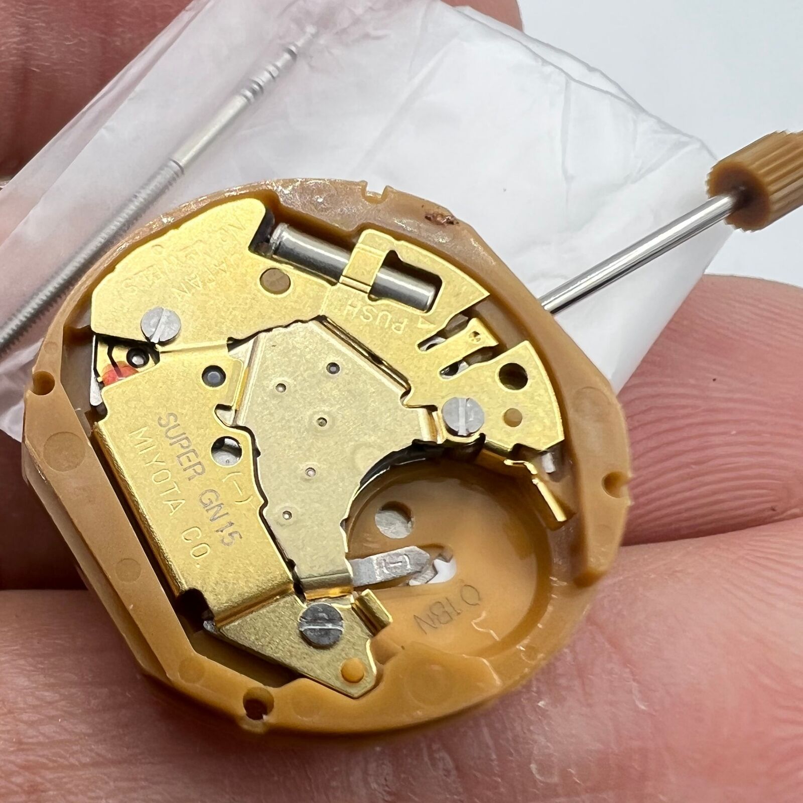 Miyota GN15 quartz watch movement featuring date displays at 3 and 6 o'clock, precision Japanese craftsmanship.