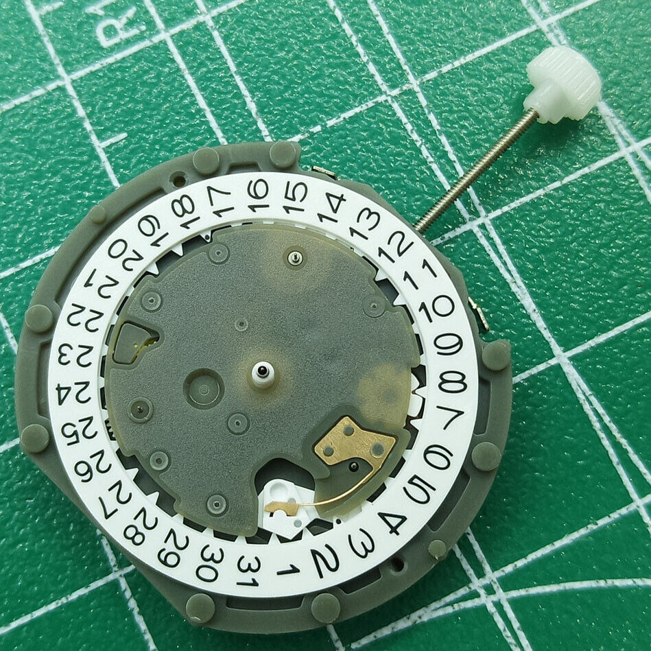 Sunon PE50 quartz watch movement with date at 3 and small seconds at 2, 6, 10 positions.