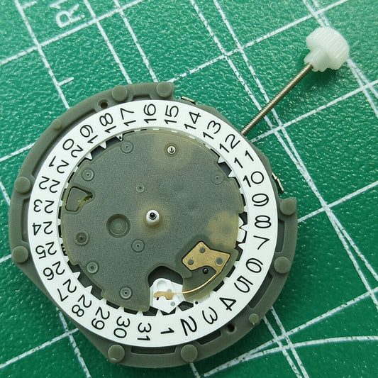 Sunon PE50 quartz watch movement with date at 3 and small seconds at 2, 6, 10 positions.