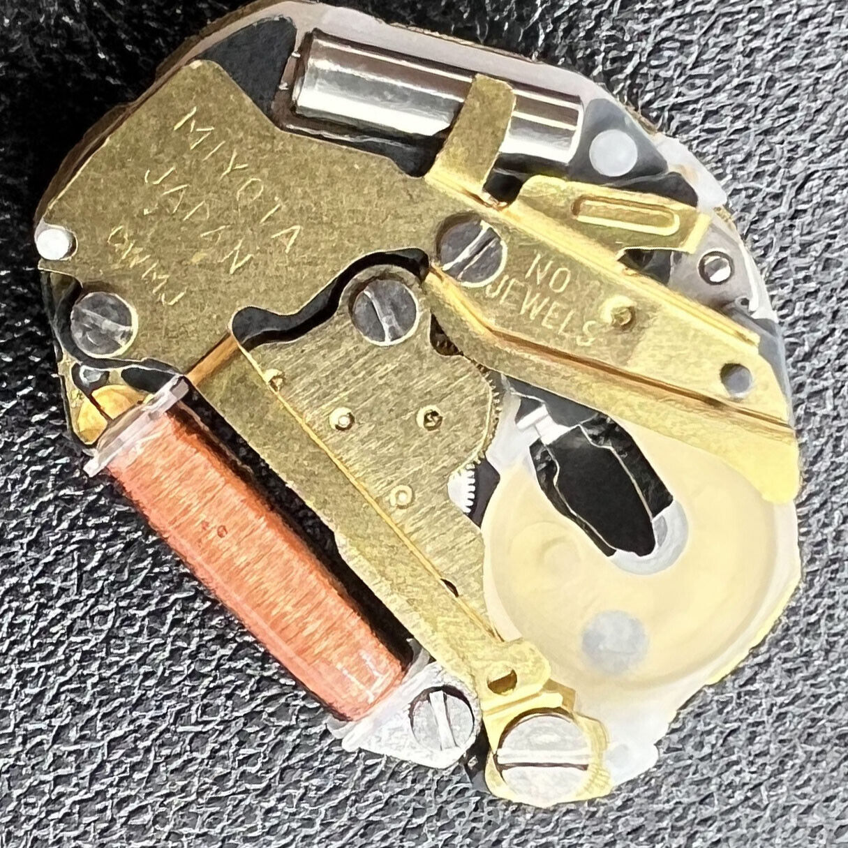 Miyota SUPER 2035 quartz movement close-up highlights Japan-made precision crafting for watch accessories.