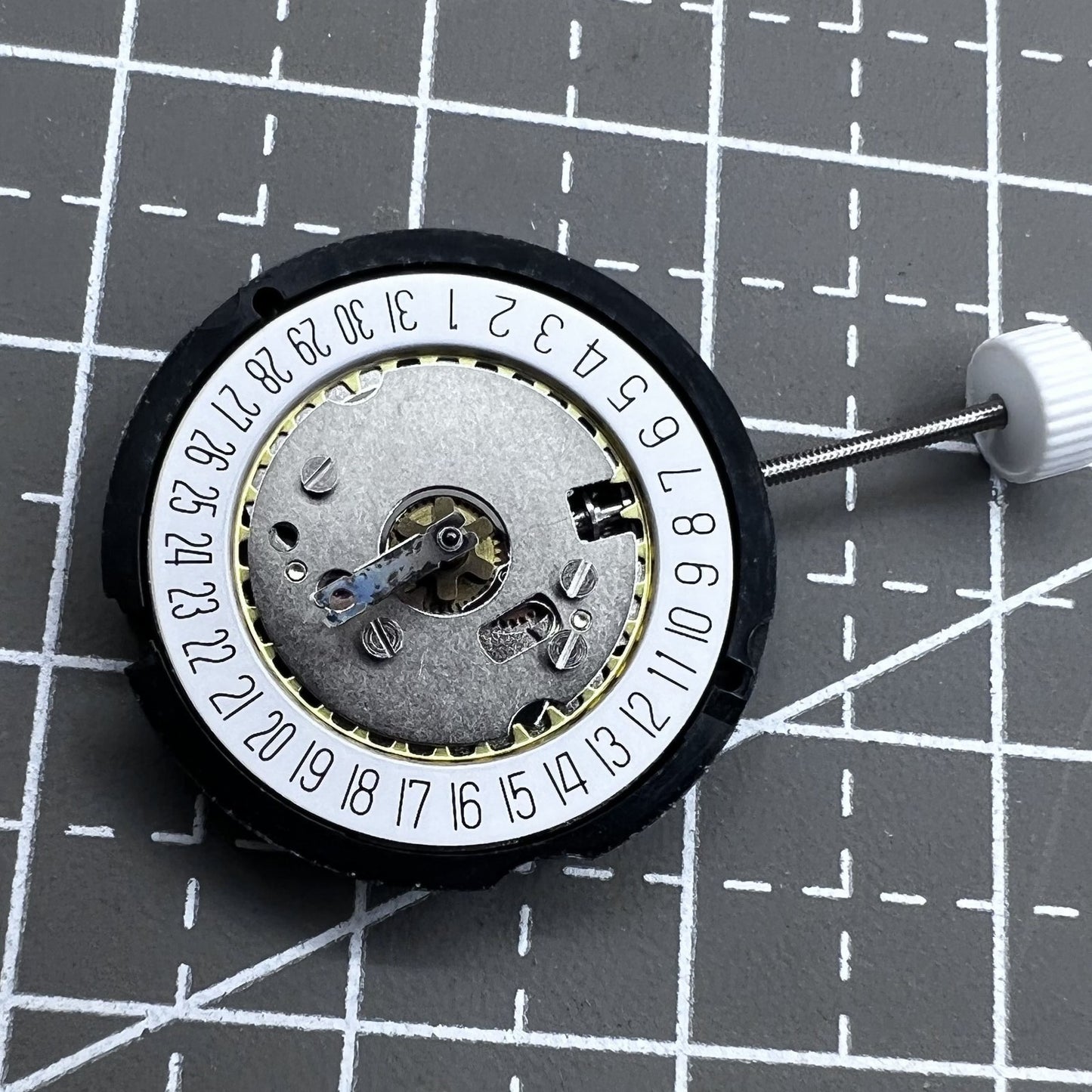 Ronda 585 Swiss quartz watch movement with date at 6 o'clock, precision timekeeping.