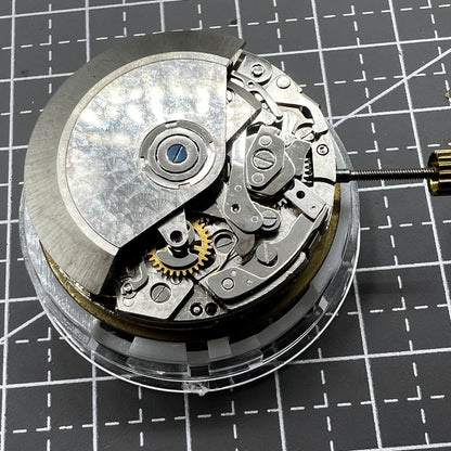 Dandong 7750 mechanical watch movement with small seconds at 3, 6, 9 o?clock, no calendar, precision accessory.
