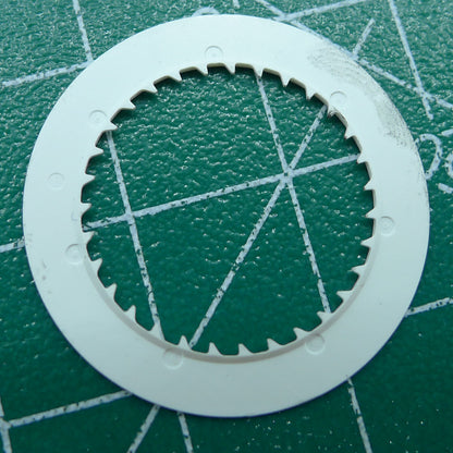 Green NH35 date disk on black background, improving date clarity and precision for watch movement.