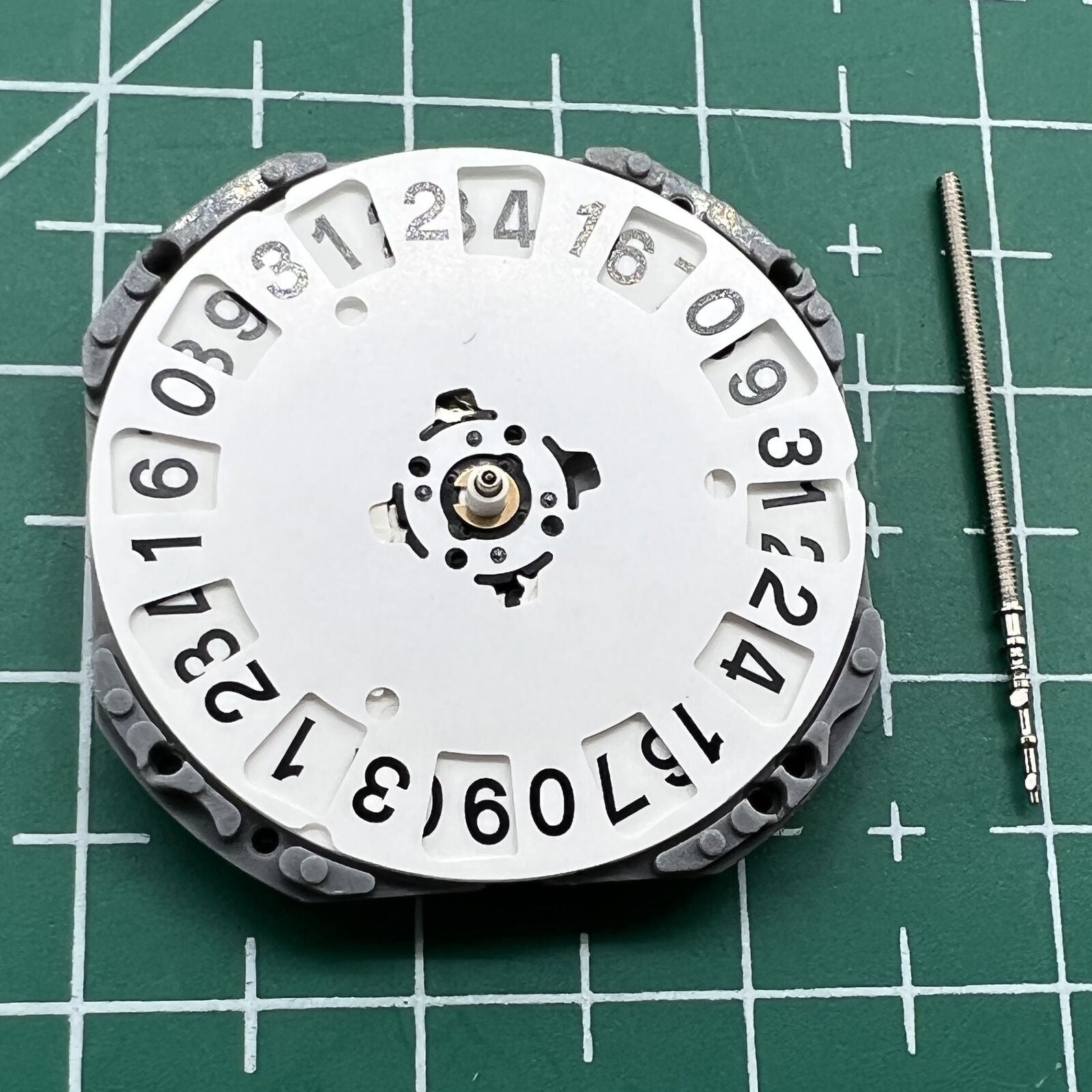 Japan Made Hattori Epson TMI VJ76 quartz watch movement with date display at 6 and 12 o'clock positions.