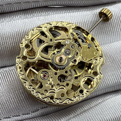 Golden 26.5mm 7120 automatic mechanical watch movement with intricate carved hollow design for luxury watchmaking.
