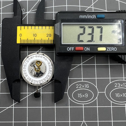 ETA 555.415 quartz watch movement with date window and three hands, vintage original part by ETA.
