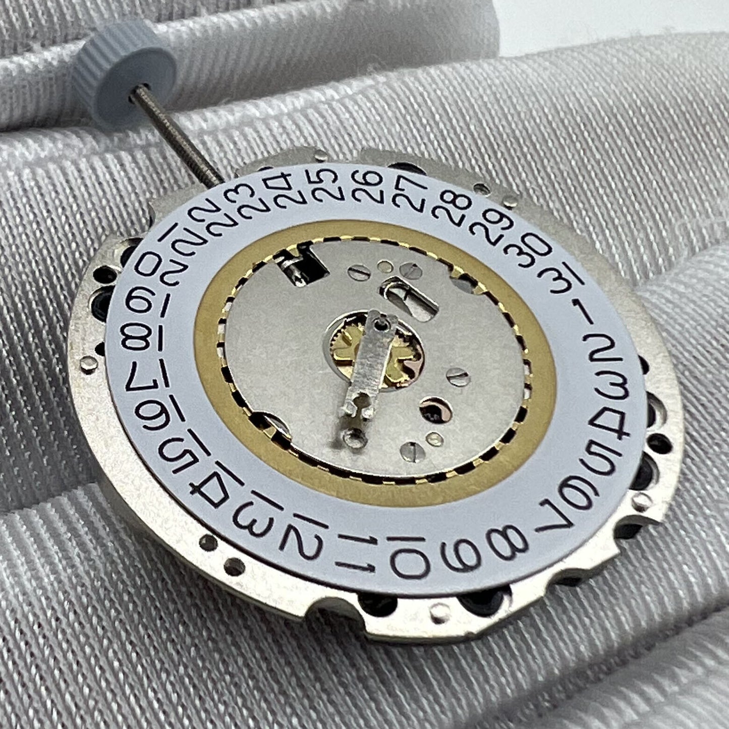 Swiss Made Ronda 705 quartz watch movement with date at 3 and 6 o'clock, precise timekeeping.