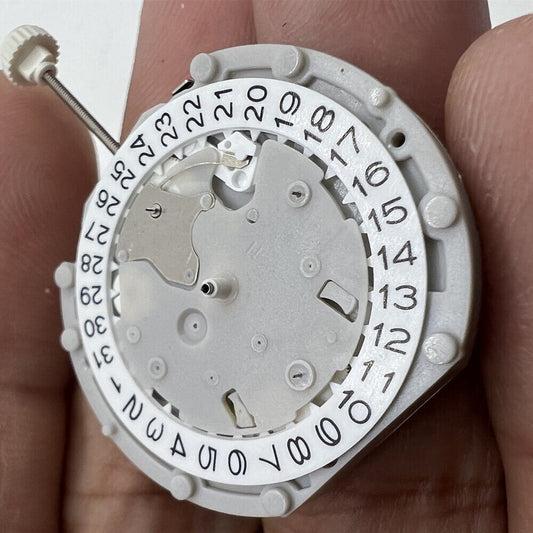Sunon PE70 quartz watch movement, 3 hands, 3 eyes, date display at 3 and 6 o'clock positions.