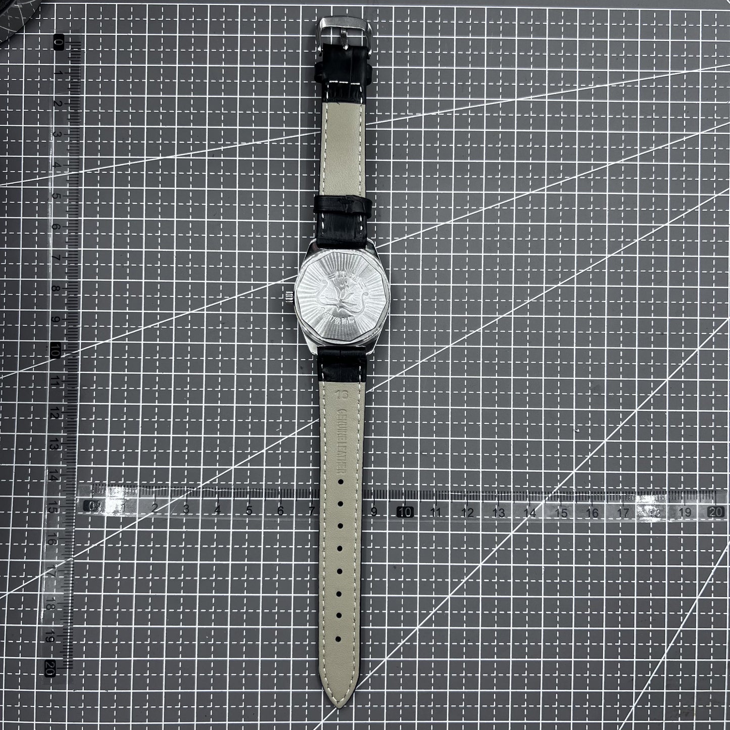 Taihang 32mm manual watch with black strap, gold markers, and black dial for classic elegance.