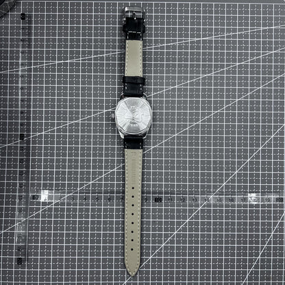 Taihang 32mm manual watch with black strap, gold markers, and black dial for classic elegance.