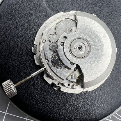 Tianjin Seagull ST25 automatic watch movement with large date and three hands, made in China.