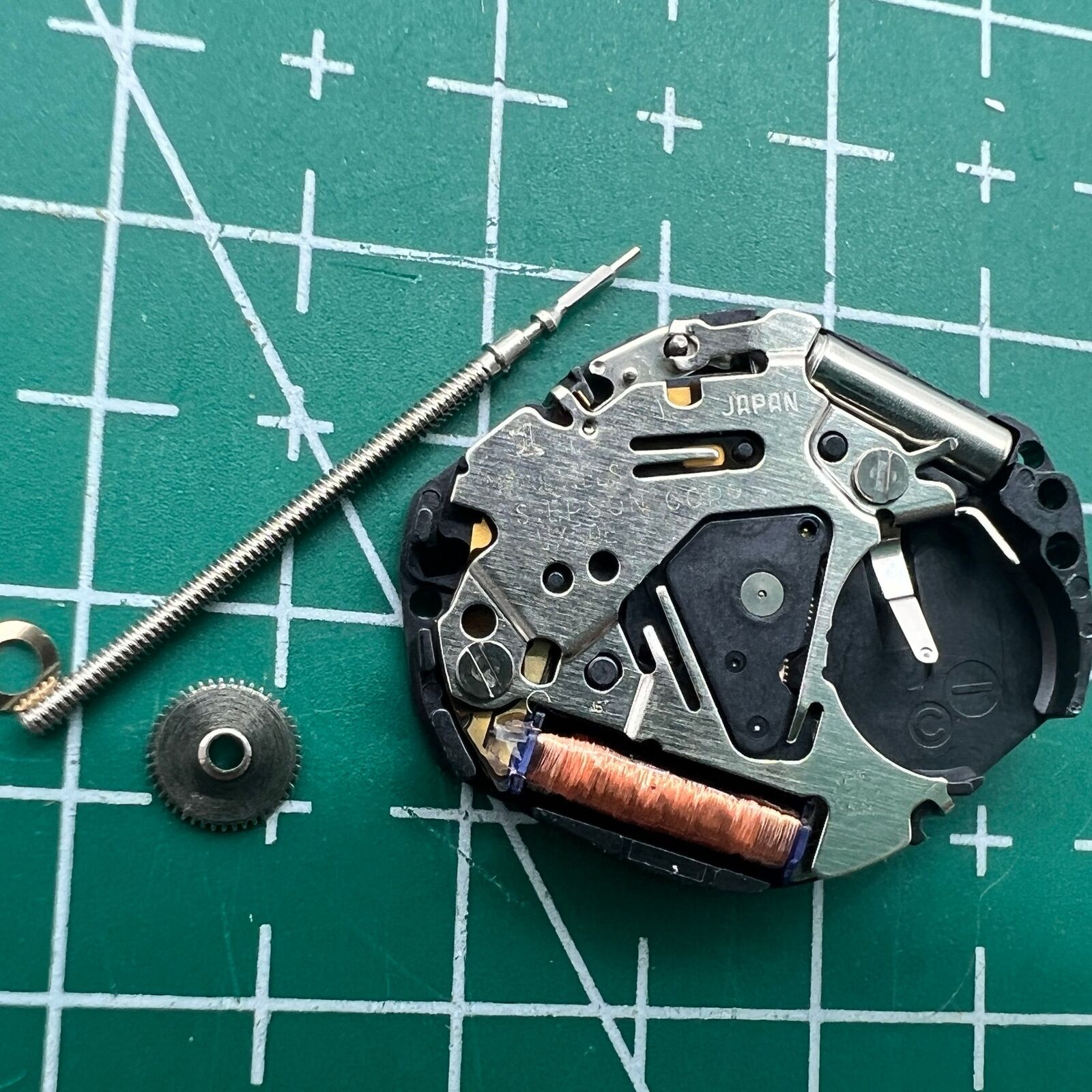 Hattori Epson TMI VX50E quartz watch movement, precision Japan-made mechanism for watch repair and accessories.