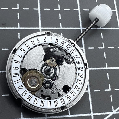 Swiss ETA95614 quartz movement watch mechanism with 2 hands and single calendar date at 6 o'clock, precision timekeeping.