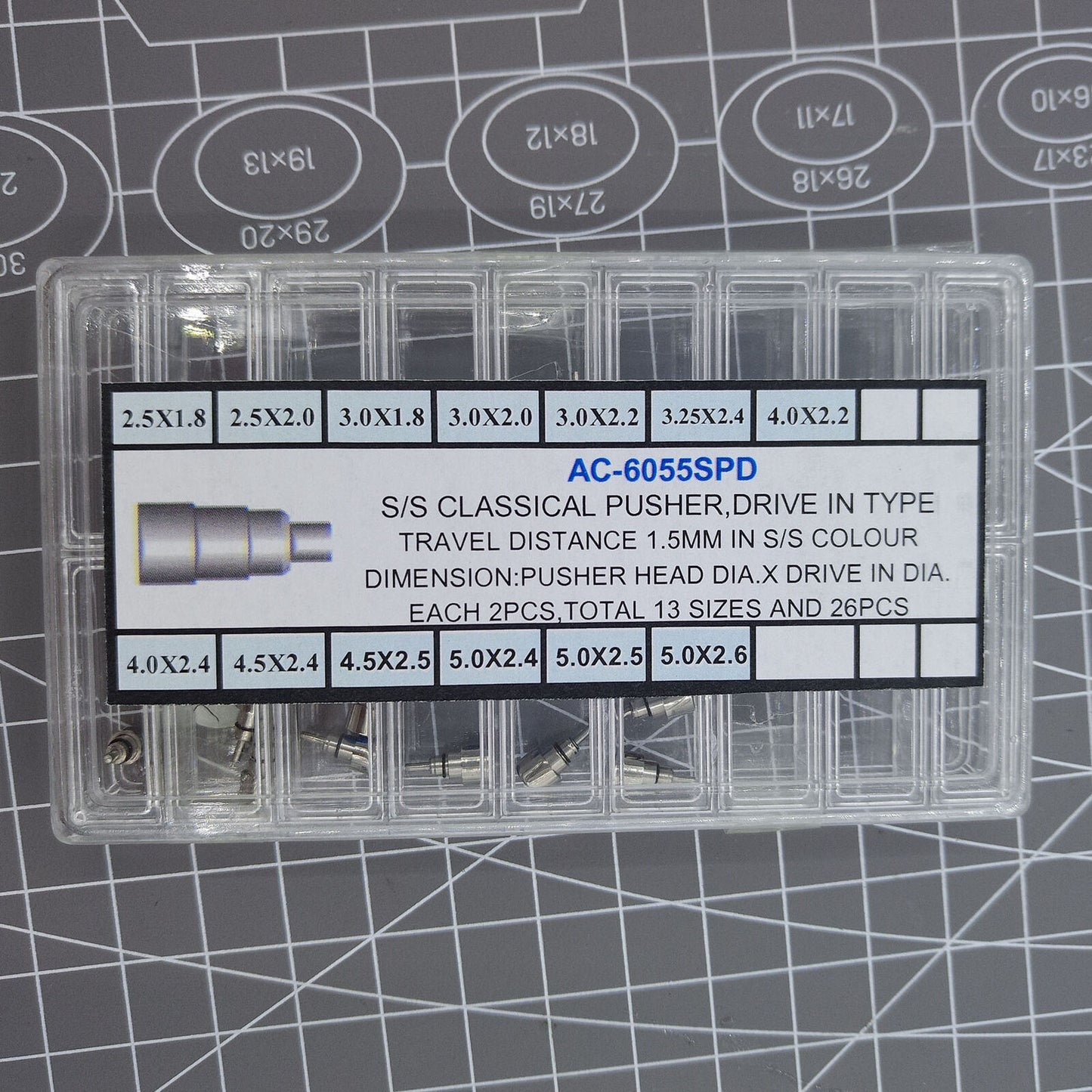 Classic stainless steel chronograph button set with 26 screw-in pushers for watch repair and customization.