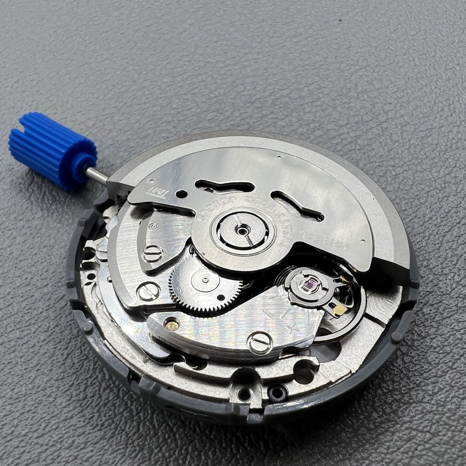 Seiko NH36 watch movement with white dial, bilingual Japanese-English day display, 3.8mm crown, reliable precision.