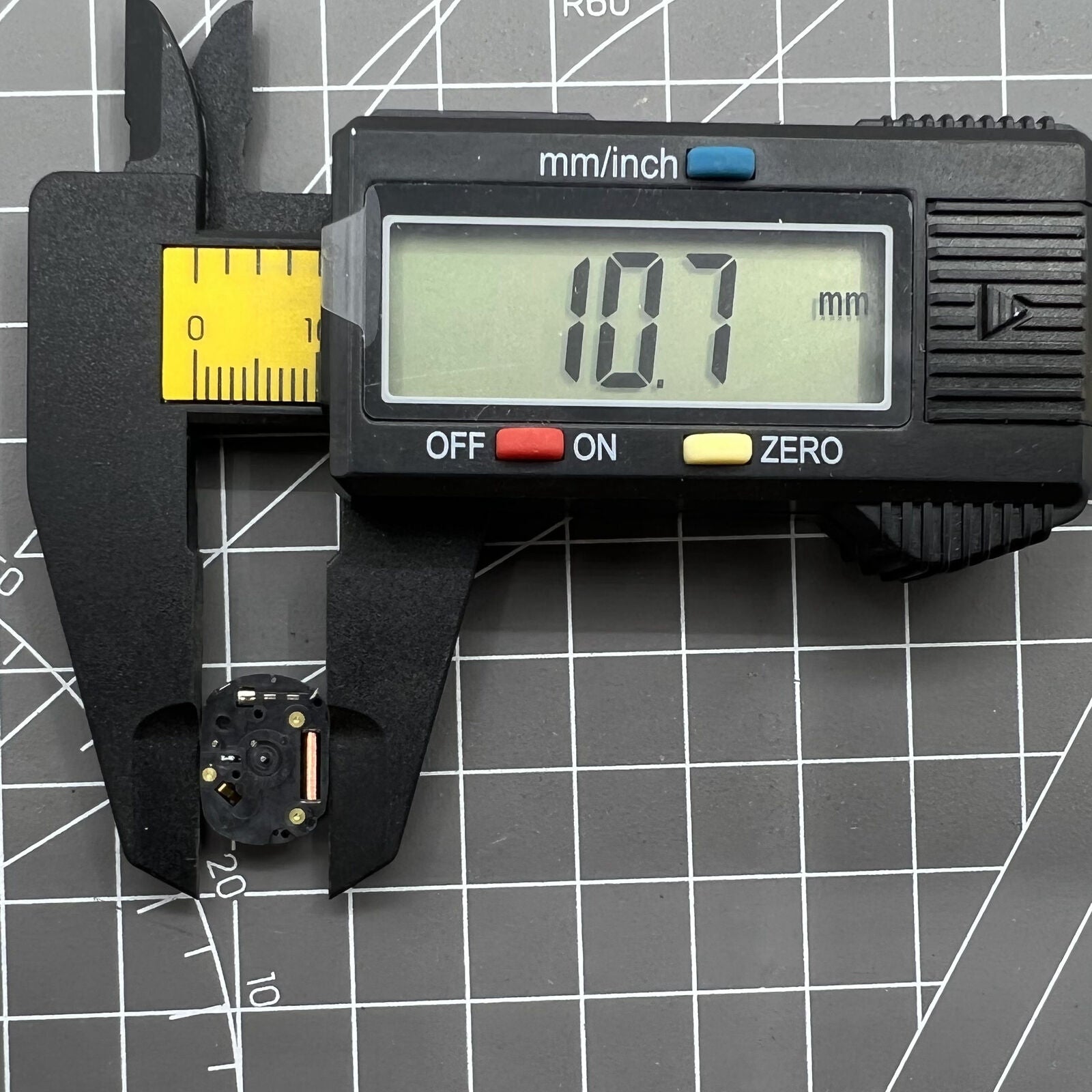 Hattori Epson VX00A quartz watch movement, precise Japan-made part for watch accessory repairs.