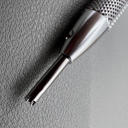 Prong spokes watch screwdriver for precise Richard Mille screw removal and case adjustments.