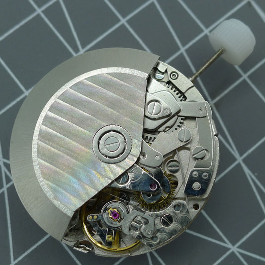 Asia Made 7751 7753 watch movement showing moon phase and mechanical hardware details.