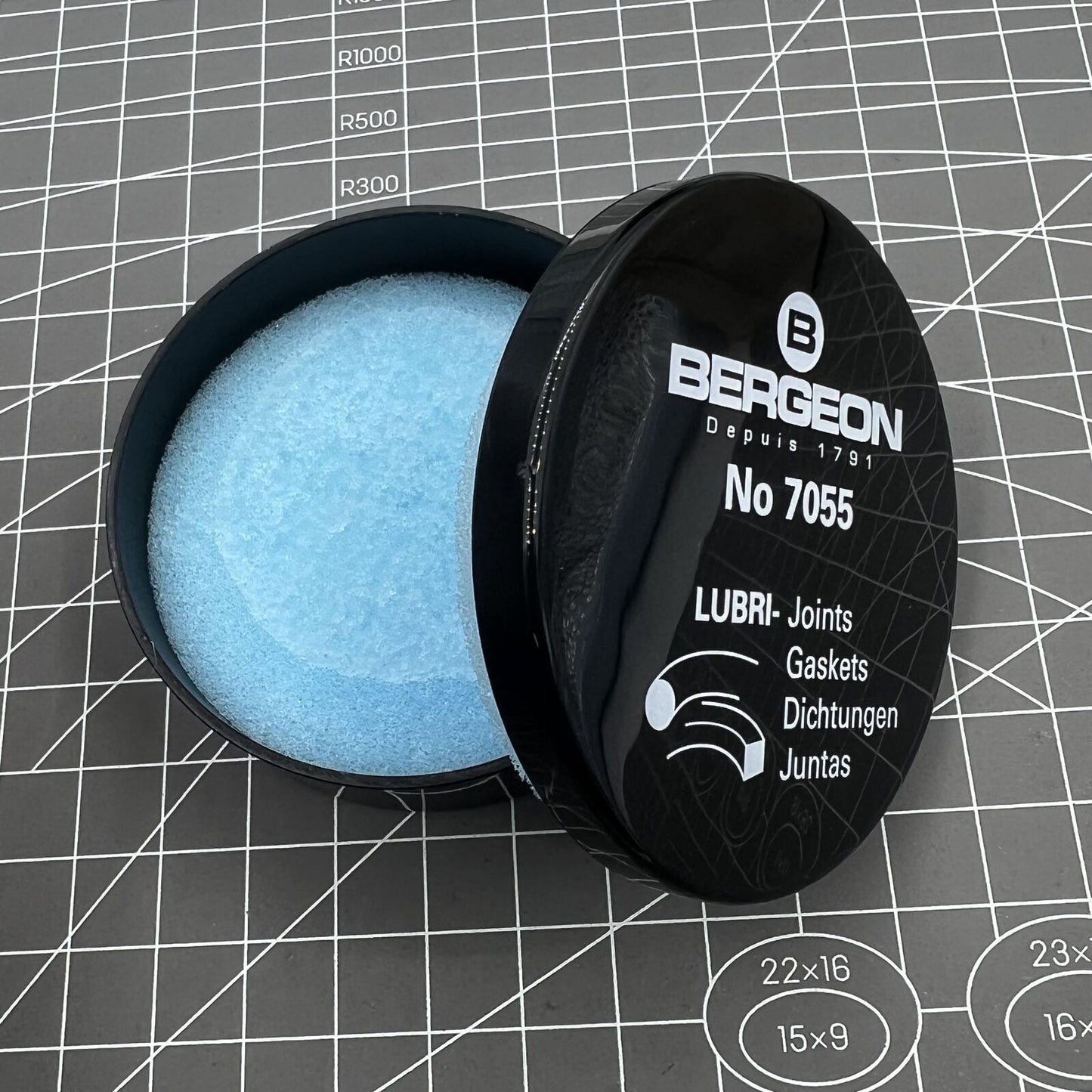 Swiss Bergeon 7055 lubricant greasing watch seals for optimal gasket protection and smooth performance.