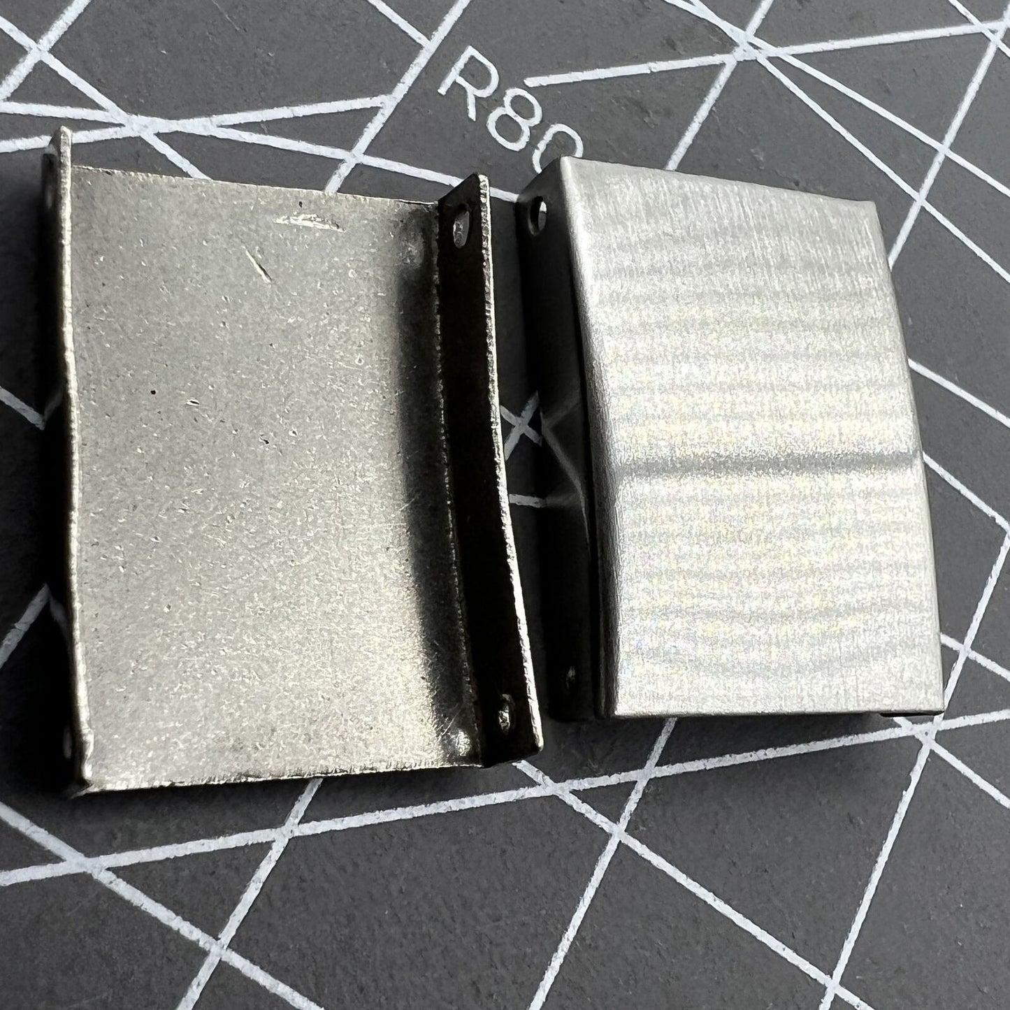 Set of 18 silver 3-fold watch strap buckles extenders in 9 sizes for versatile watch customization.