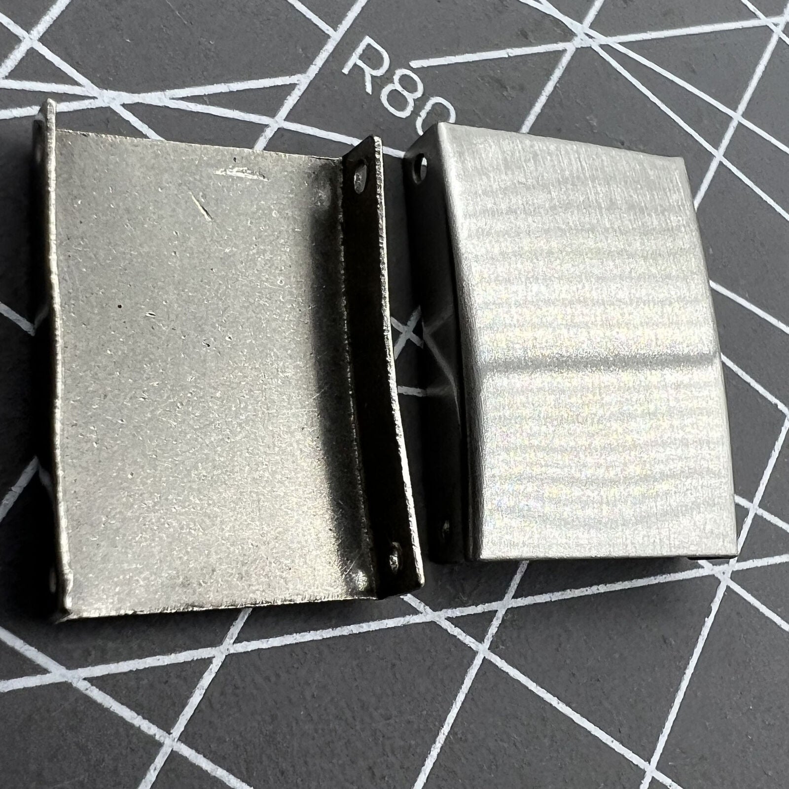 Set of 18 silver 3-fold watch strap buckles extenders in 9 sizes for versatile watch customization.