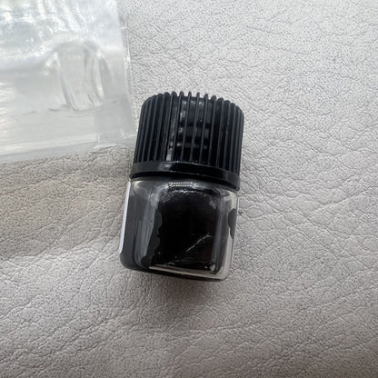 Swiss Black Mainspring Schmiermittel 0.5ml bottle for precise P125 watch movement lubrication.