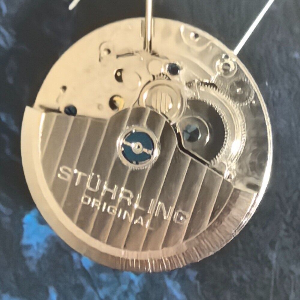 Silver mechanical watch part for big date single calendar, precision movement, ideal for China-made timepieces.