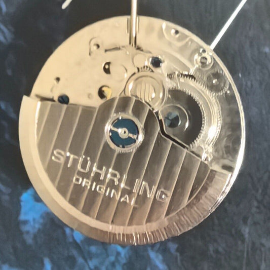 Silver mechanical watch part for big date single calendar, precision movement, ideal for China-made timepieces.