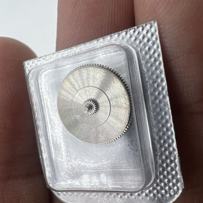 Miyota 9100 watch barrel with complete mainspring, precision spare part for watch repairs.