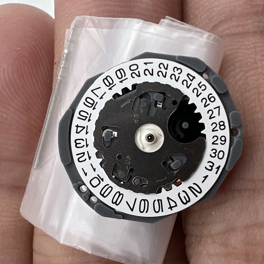 Hattori Epson VJ22 quartz watch movement with date at 3 and 6, Japanese precision craftsmanship