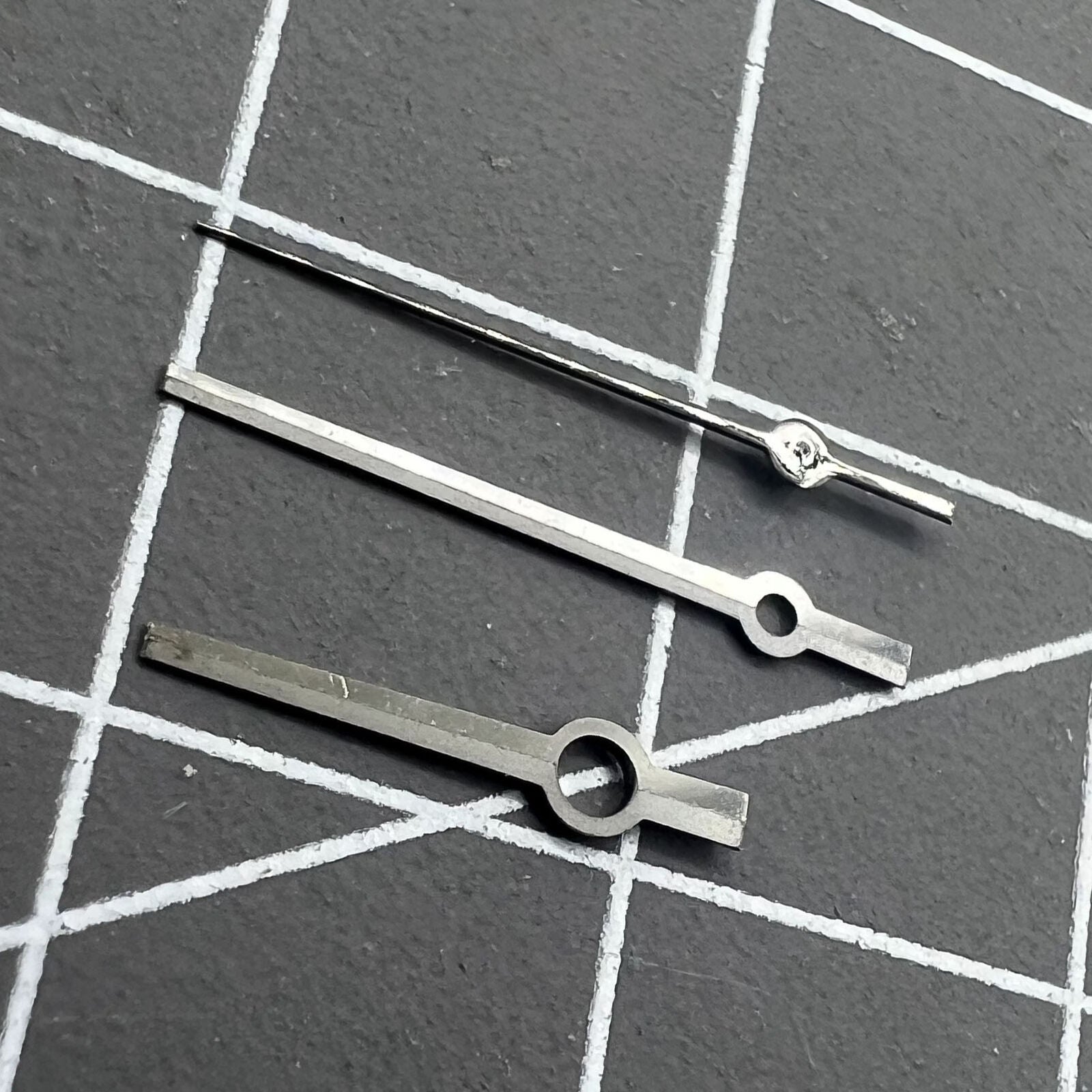 Black watch hands set without luminous for NH35A/NH36A movement, compatible with various watch models.