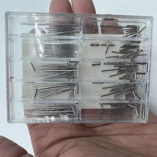 Stainless steel pins with tubes for watch bracelet adjustment, ideal for precise strap repairs.