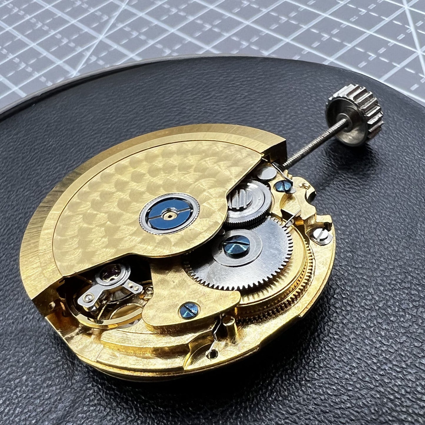 Multifunctional automatic watch with mechanical movement, date at 2 o'clock, and 24-hour digital dial.