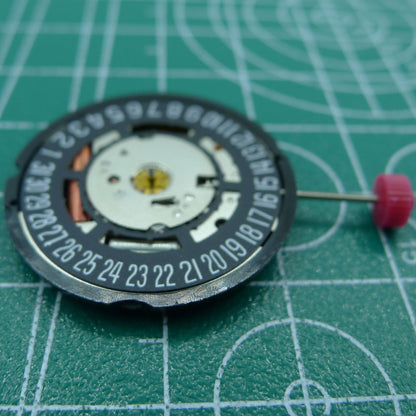 Swiss Part Ronda 715 quartz watch movement with black date wheel at 6 o'clock, ideal replacement part for watches.