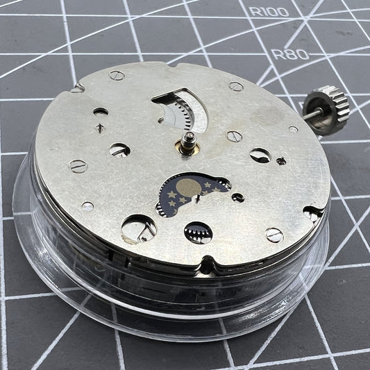 Close-up of China Made Hangzhou automatic kinetic watch with small second at 4 and no rotor, showcasing precise movement.