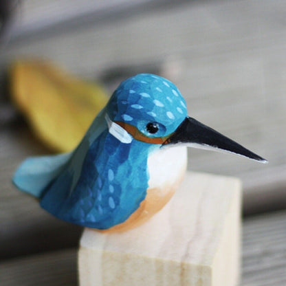 Handmade blue bird wooden figurine, decorative collectible artwork for home display.