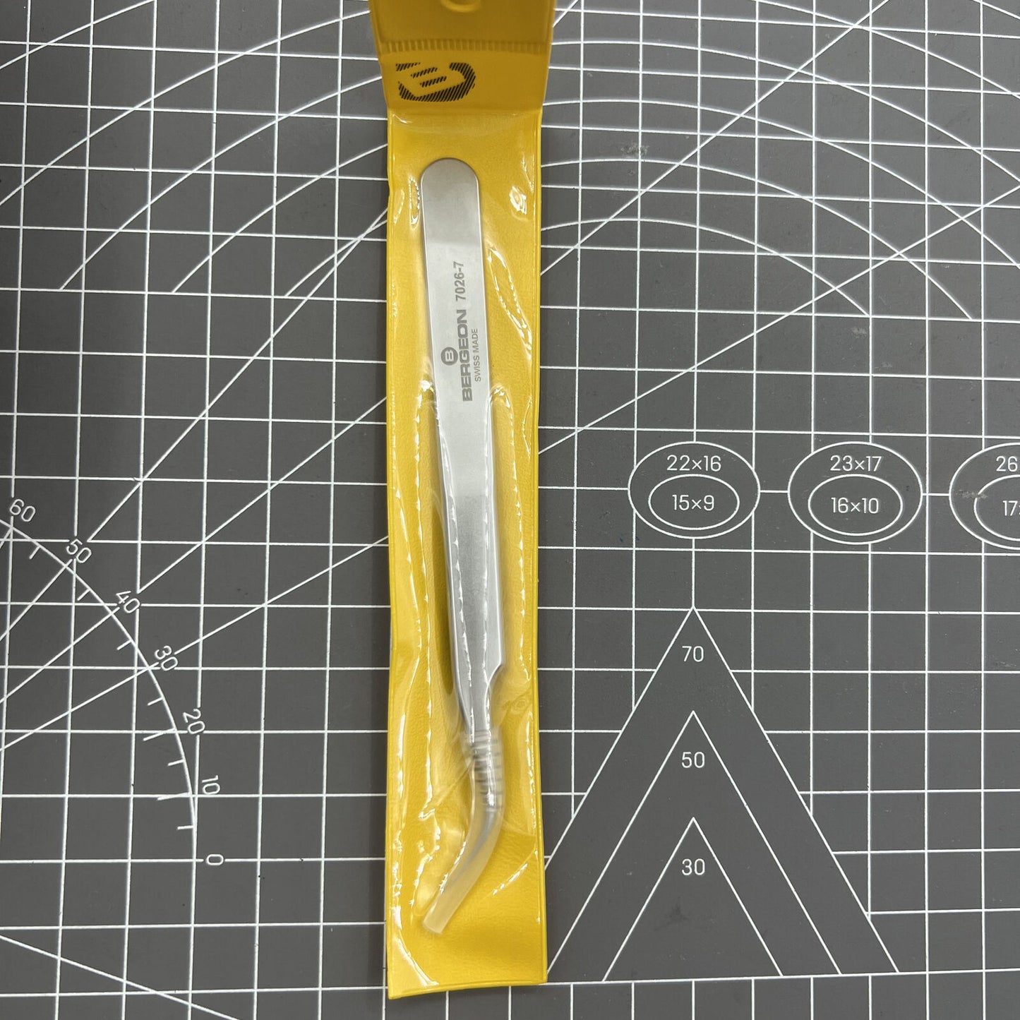 Swiss Bergeon 7026-7 antimagnetic tweezer with fine curved points for precise watch accessory handling.