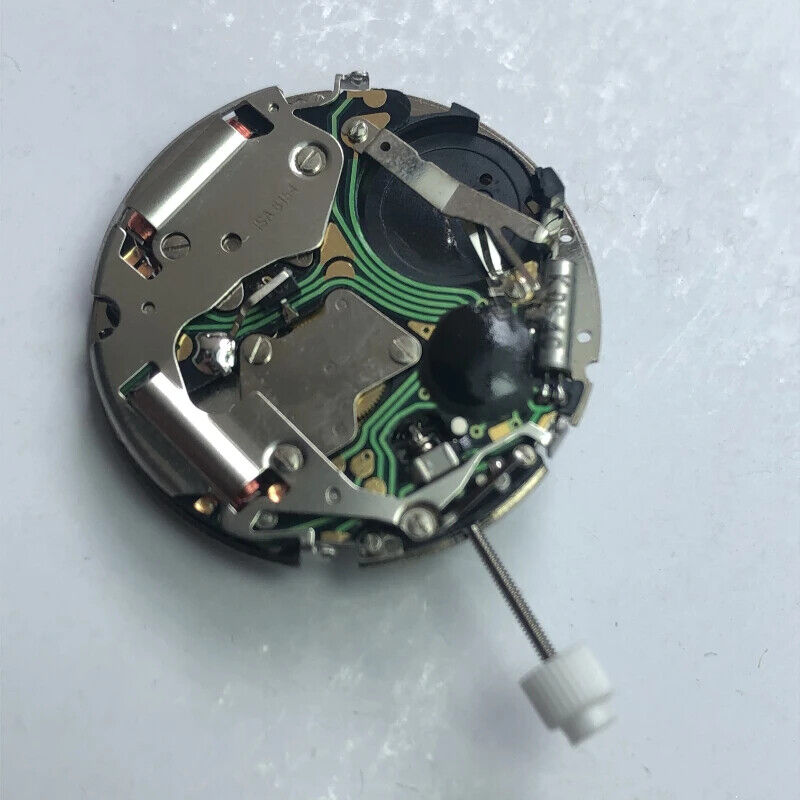 Swiss Made ISA 8154 quartz watch movement with date at 4 and alarm clock function.