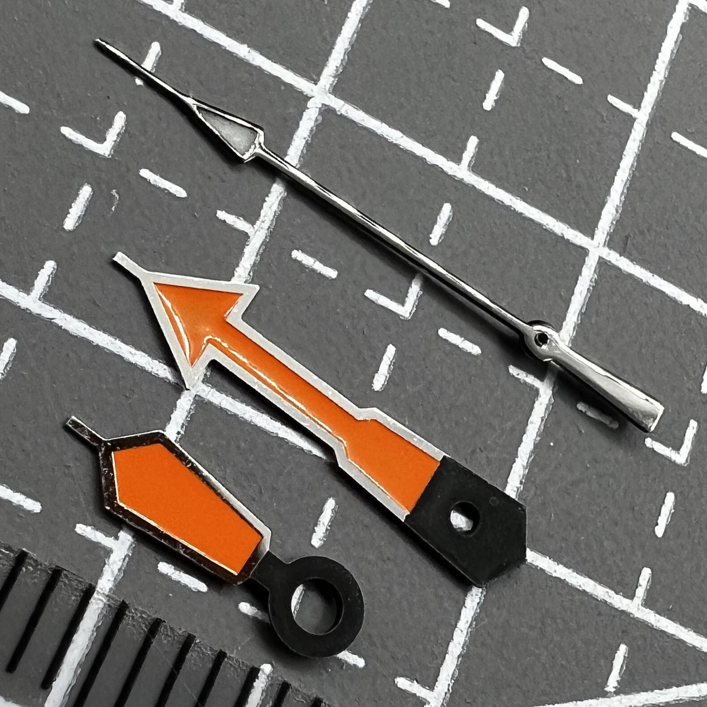 Seiko NH36 IH36 watch movement with dark gray bezel, orange lacquer, black hands, and green lume detail.