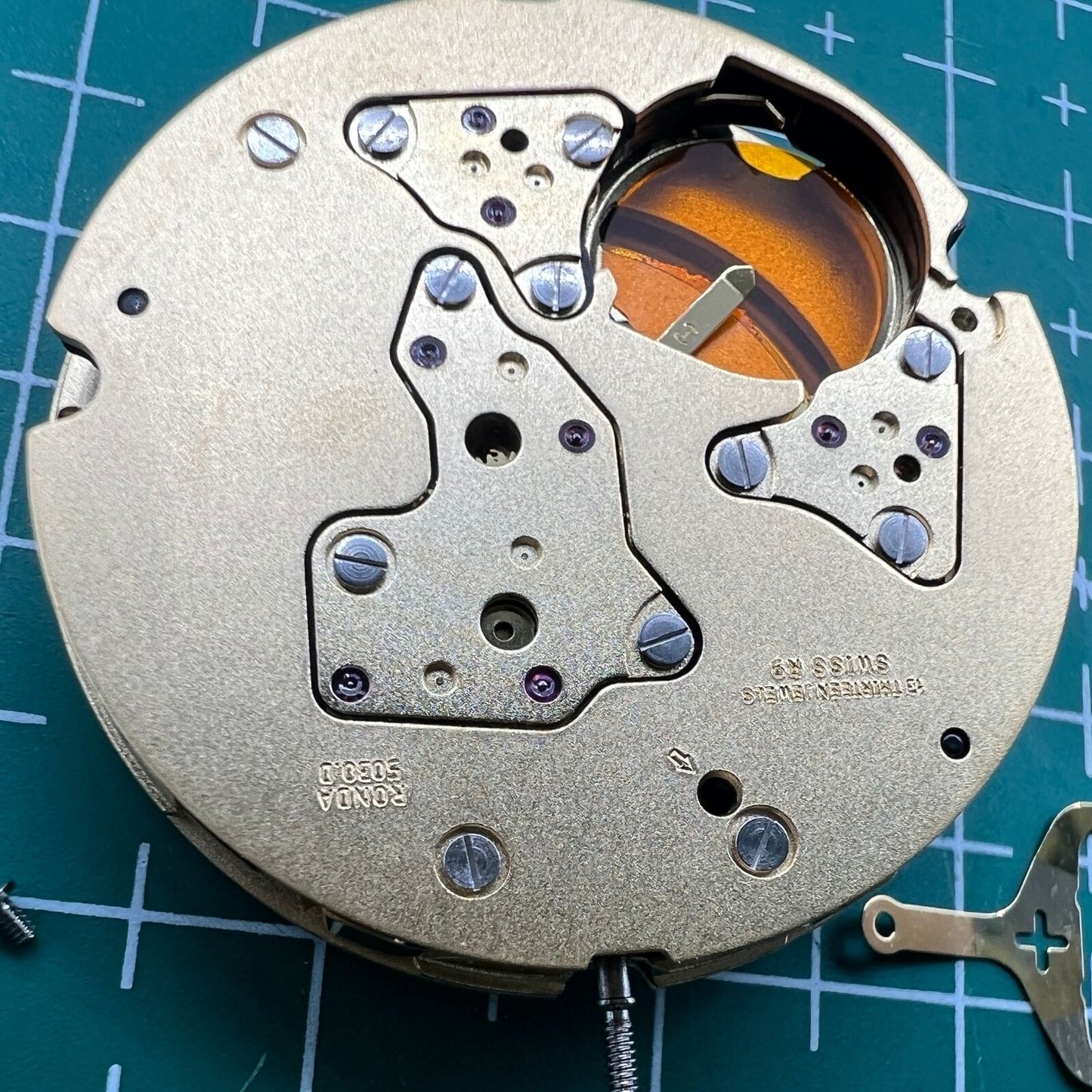 Swiss Made Ronda 5030D quartz watch movement with date window at 6 o'clock, ideal for precise watch repair.
