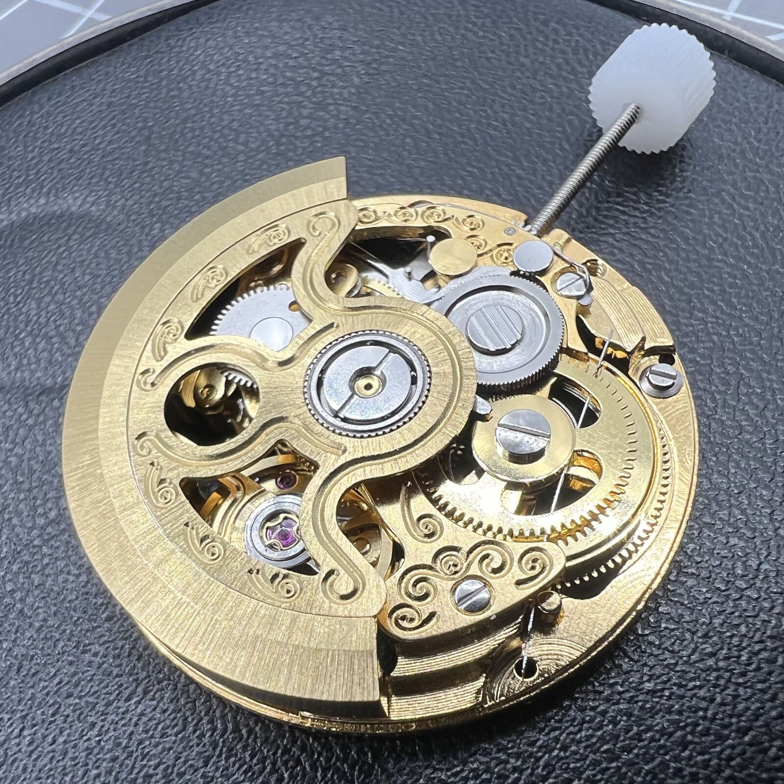 Hangzhou 2189 automatic watch movement featuring golden 3-hand skeleton design for accurate timekeeping.