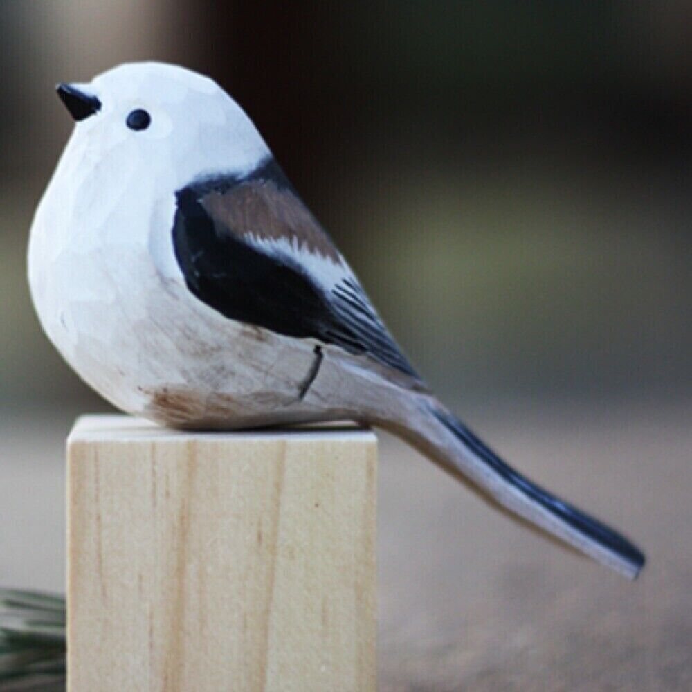 Handmade Long-tailed Tit wooden figurine, detailed bird sculpture for unique home decor.