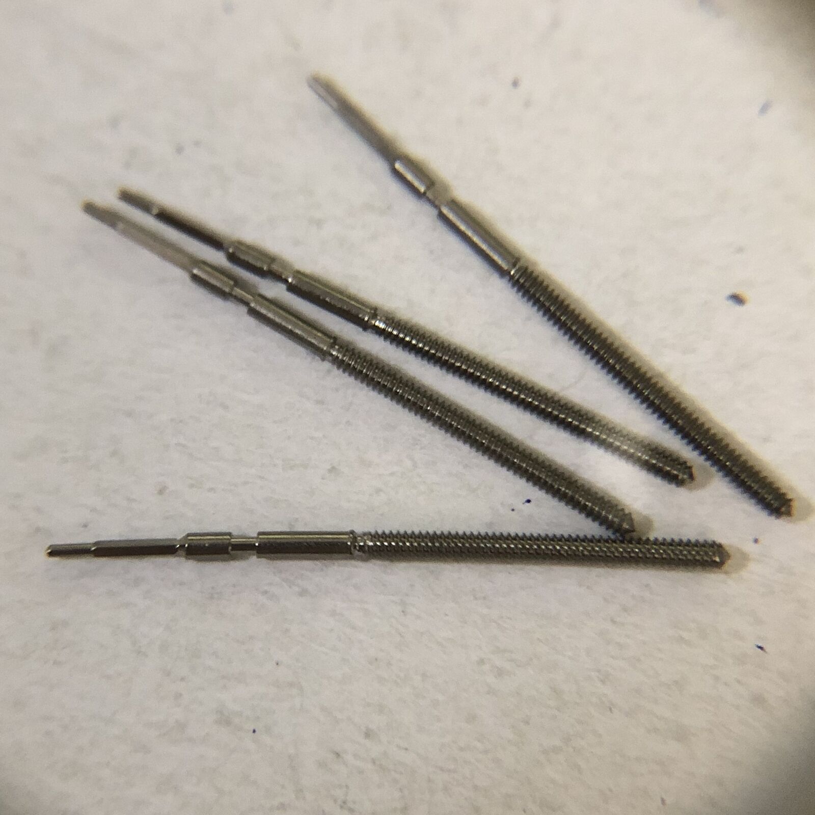 Generic watch winding stems for Ronda 1002, 1012, 1017, 1004 movements, compatible watch accessory.