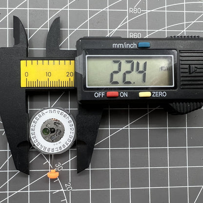 Miyota 1M12 quartz watch movement featuring three hands and date window at 3 o'clock, Japan-made precision.